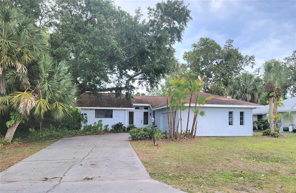 26221 Constantine Road Punta Gorda, FL 33983 - Photo 27 of 27 a front view of a house with a garden