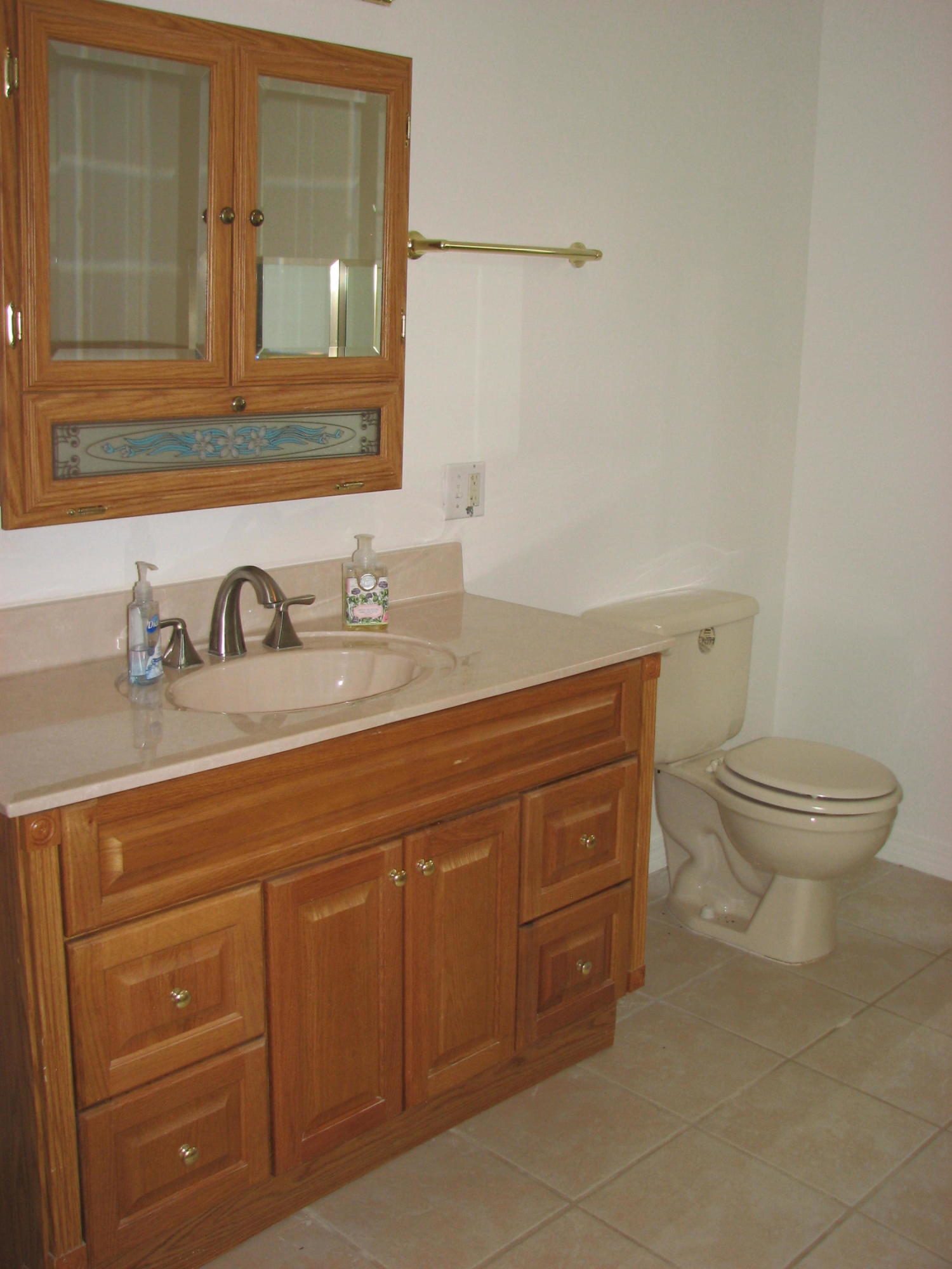 803 Melton Road Baker, FL 32531 - Photo 21 of 36 a bathroom with a granite countertop toilet sink and mirror