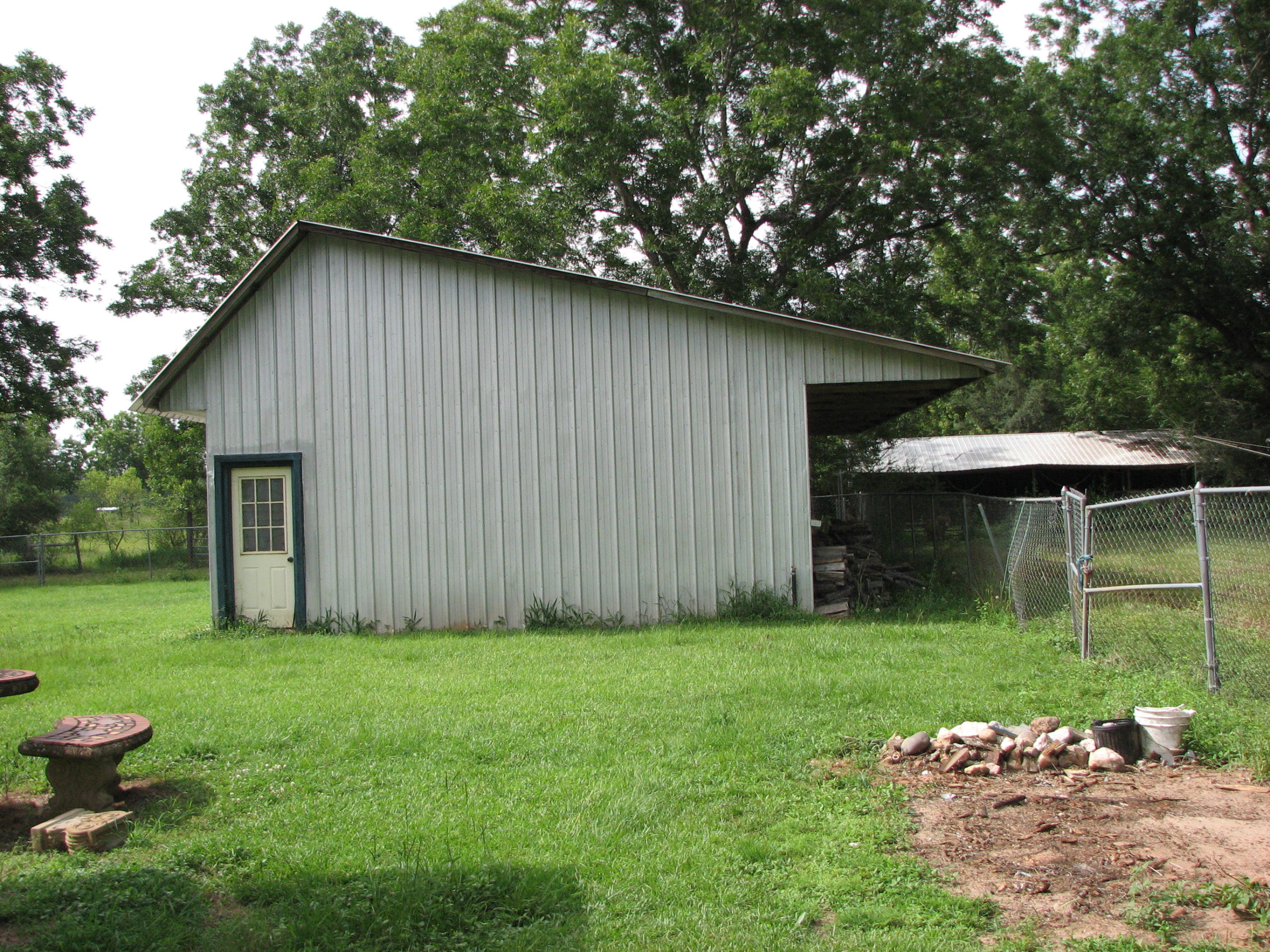 803 Melton Road Baker, FL 32531 - Photo 34 of 36 a backyard of a house with table and chairs
