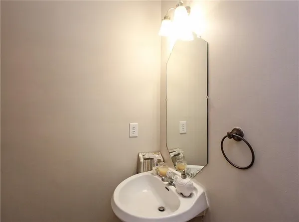 a bathroom with a sink vanity and mirror