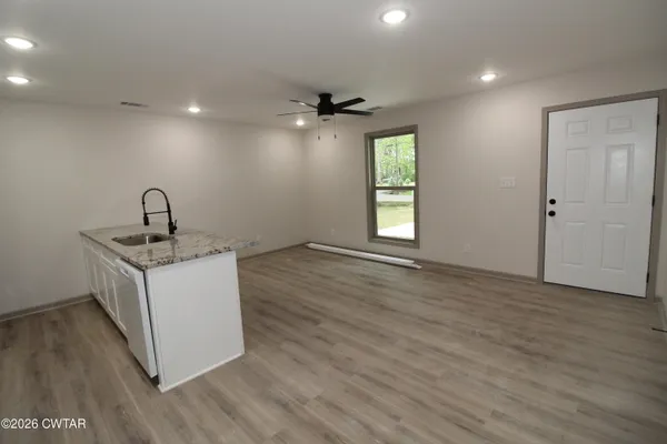 a kitchen with sink and window
