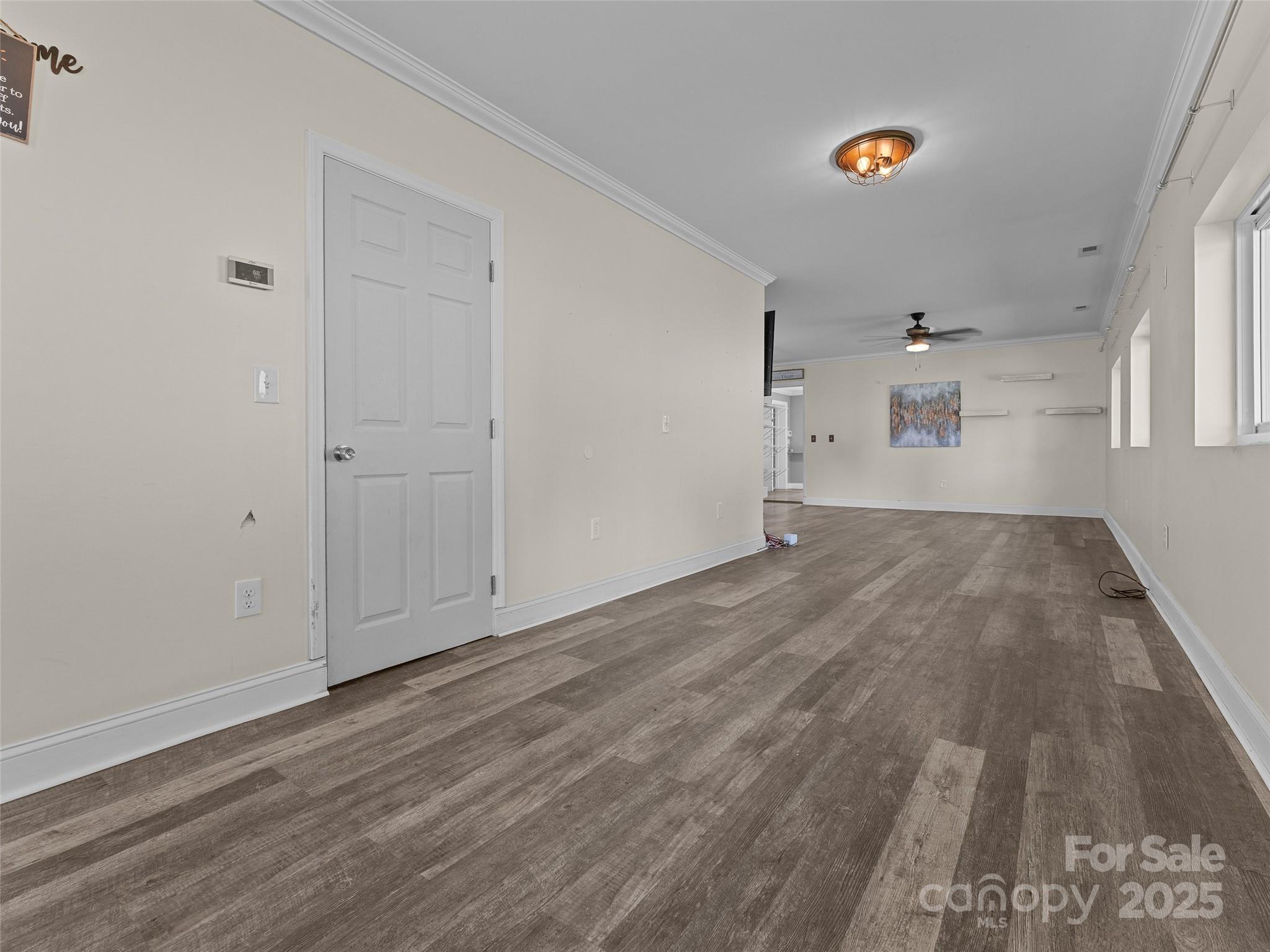 1148 North Ridge Road Hendersonville, NC 28792 - Photo 11 of 42 a view of empty room with wooden floor and fan