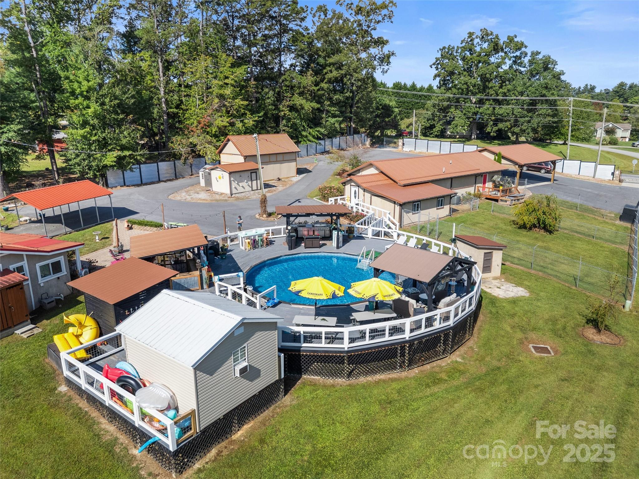 1148 North Ridge Road Hendersonville, NC 28792 - Photo 16 of 42 an aerial view of a house with swimming pool garden and patio
