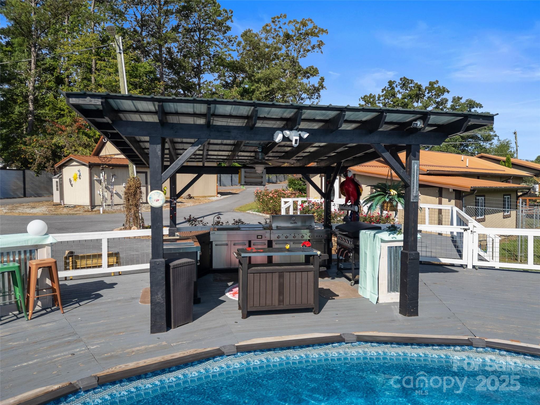 1148 North Ridge Road Hendersonville, NC 28792 - Photo 19 of 42 a view of a patio with table and chairs with wooden floor