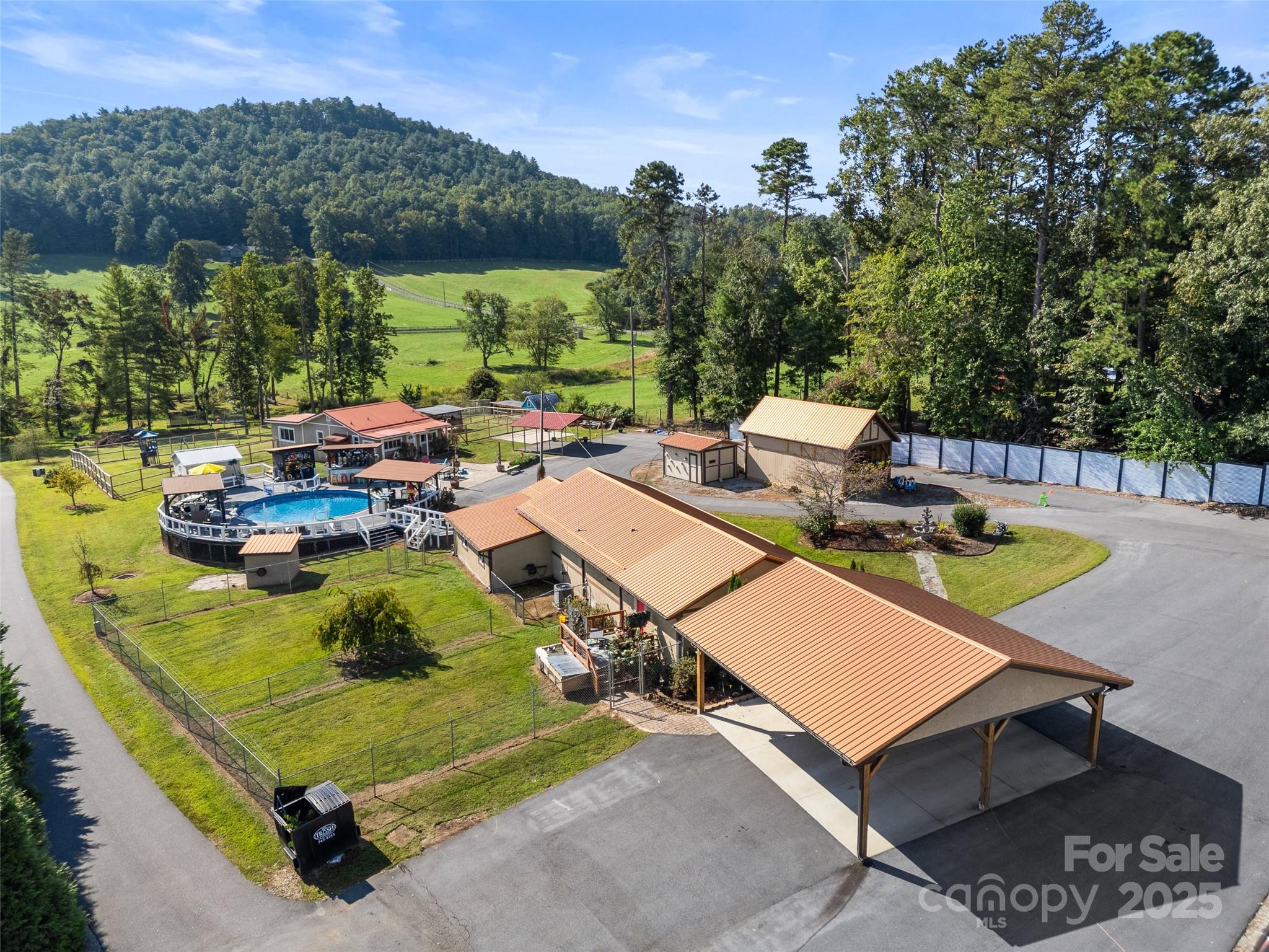 1148 North Ridge Road Hendersonville, NC 28792 - Photo 2 of 42 a view of a swimming pool with a patio
