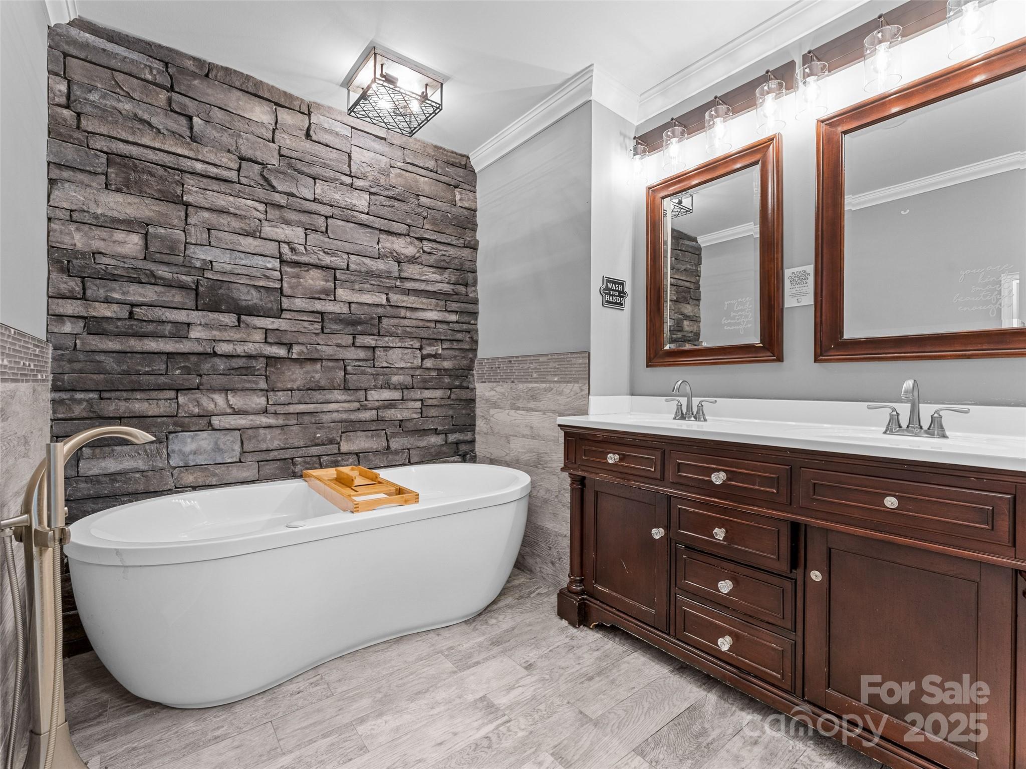 1148 North Ridge Road Hendersonville, NC 28792 - Photo 23 of 42 a spacious bathroom with a tub sink and mirror