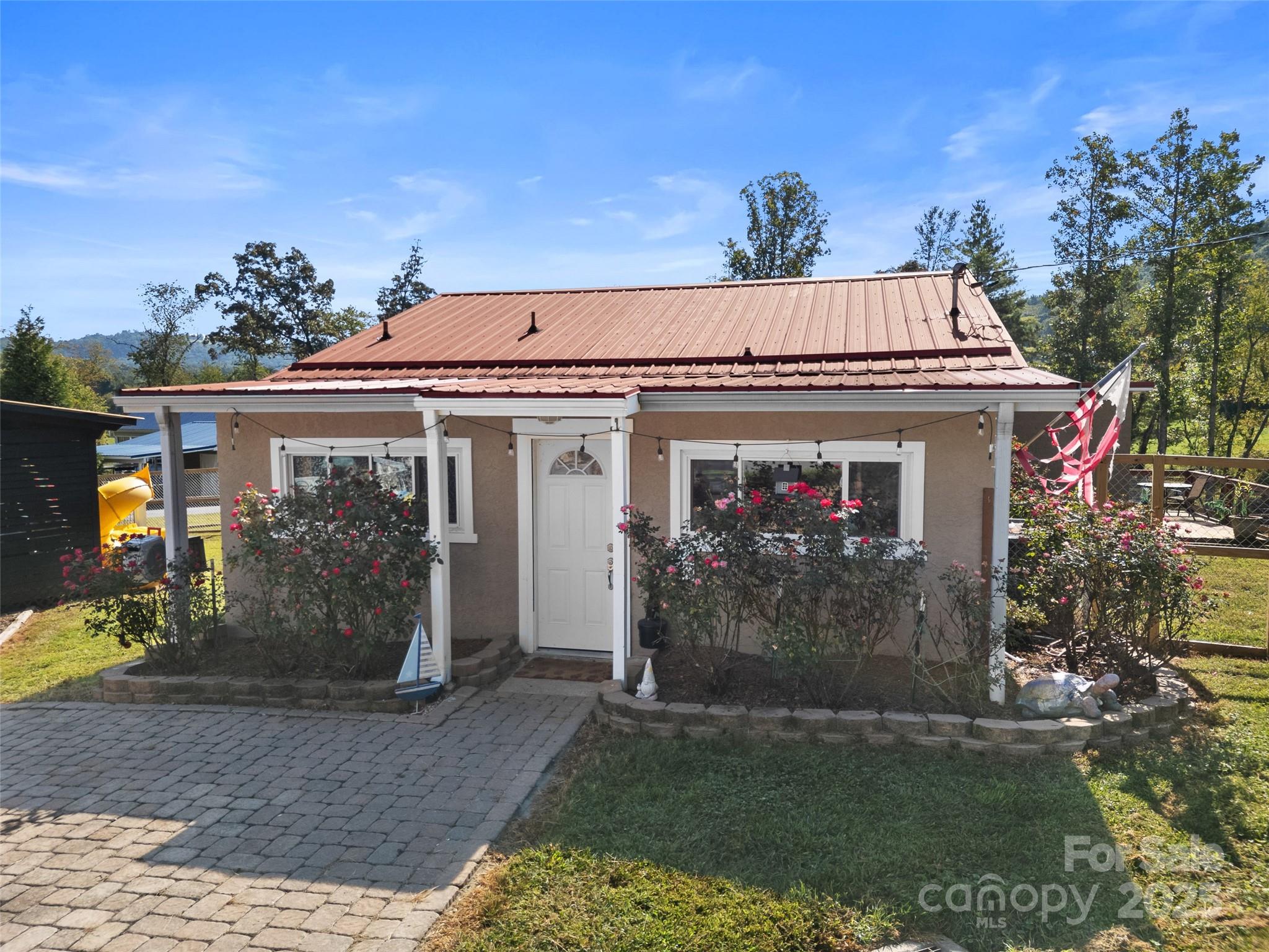 1148 North Ridge Road Hendersonville, NC 28792 - Photo 28 of 42 a view of a house with a porch