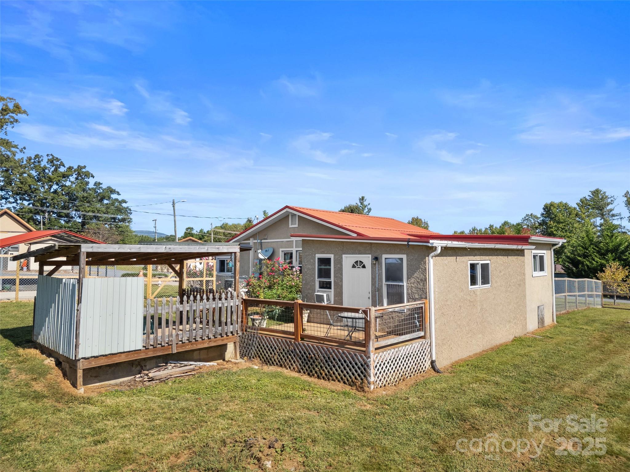 1148 North Ridge Road Hendersonville, NC 28792 - Photo 29 of 42 a view of a house with yard and sitting area