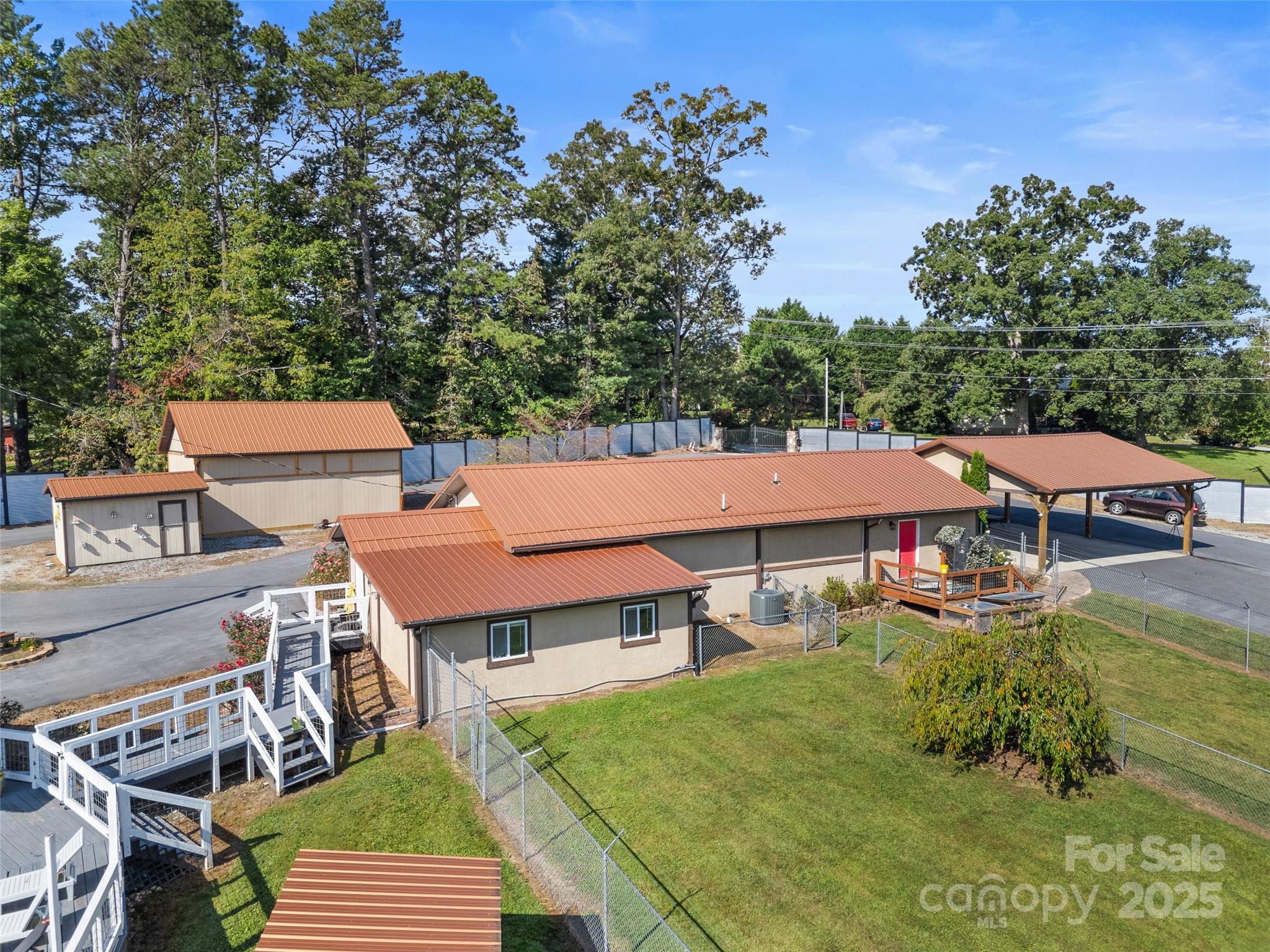 1148 North Ridge Road Hendersonville, NC 28792 - Photo 3 of 42 an aerial view of a house with swimming pool garden and patio