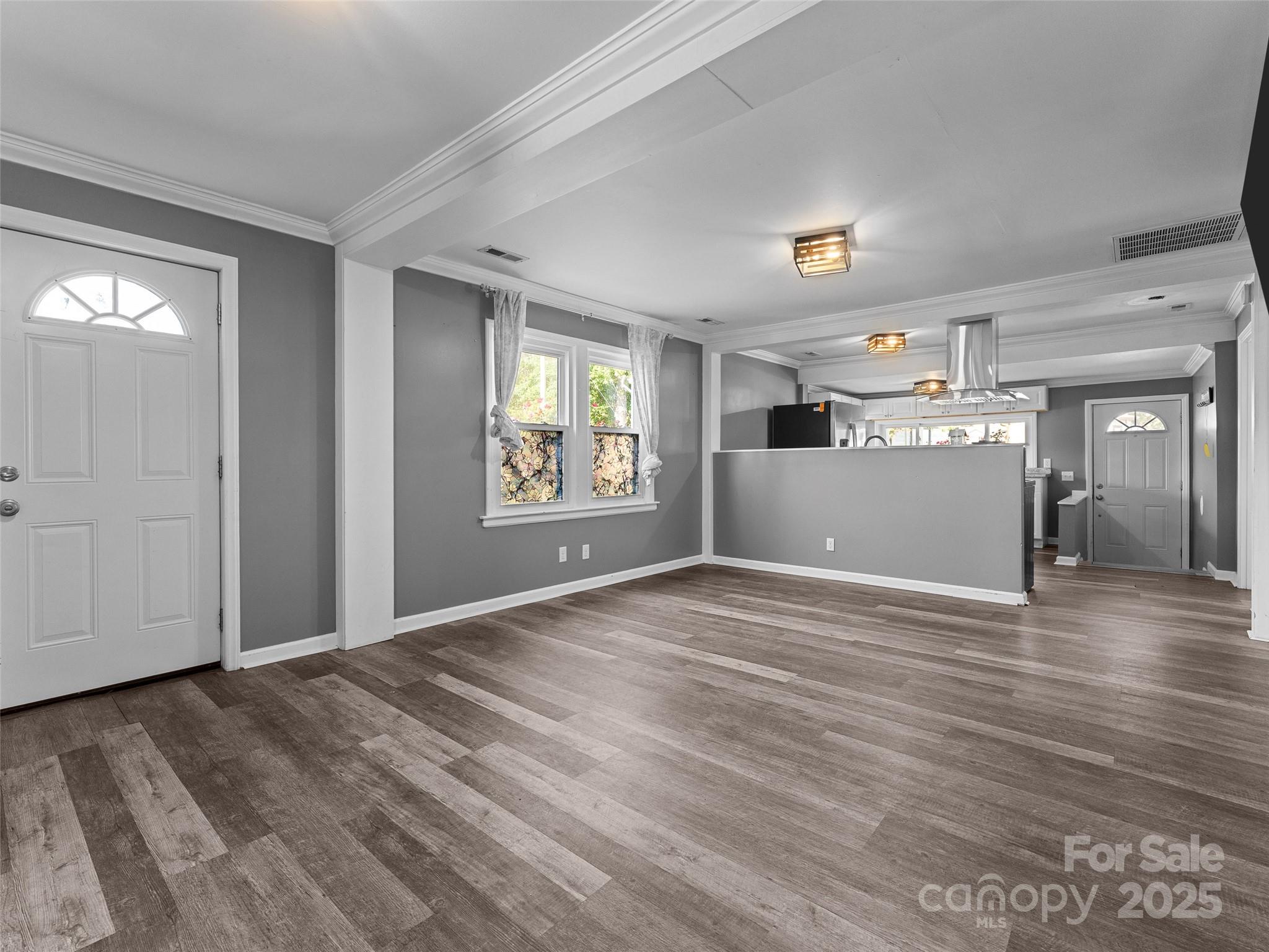 1148 North Ridge Road Hendersonville, NC 28792 - Photo 33 of 42 a view of a livingroom with wooden floor and windows