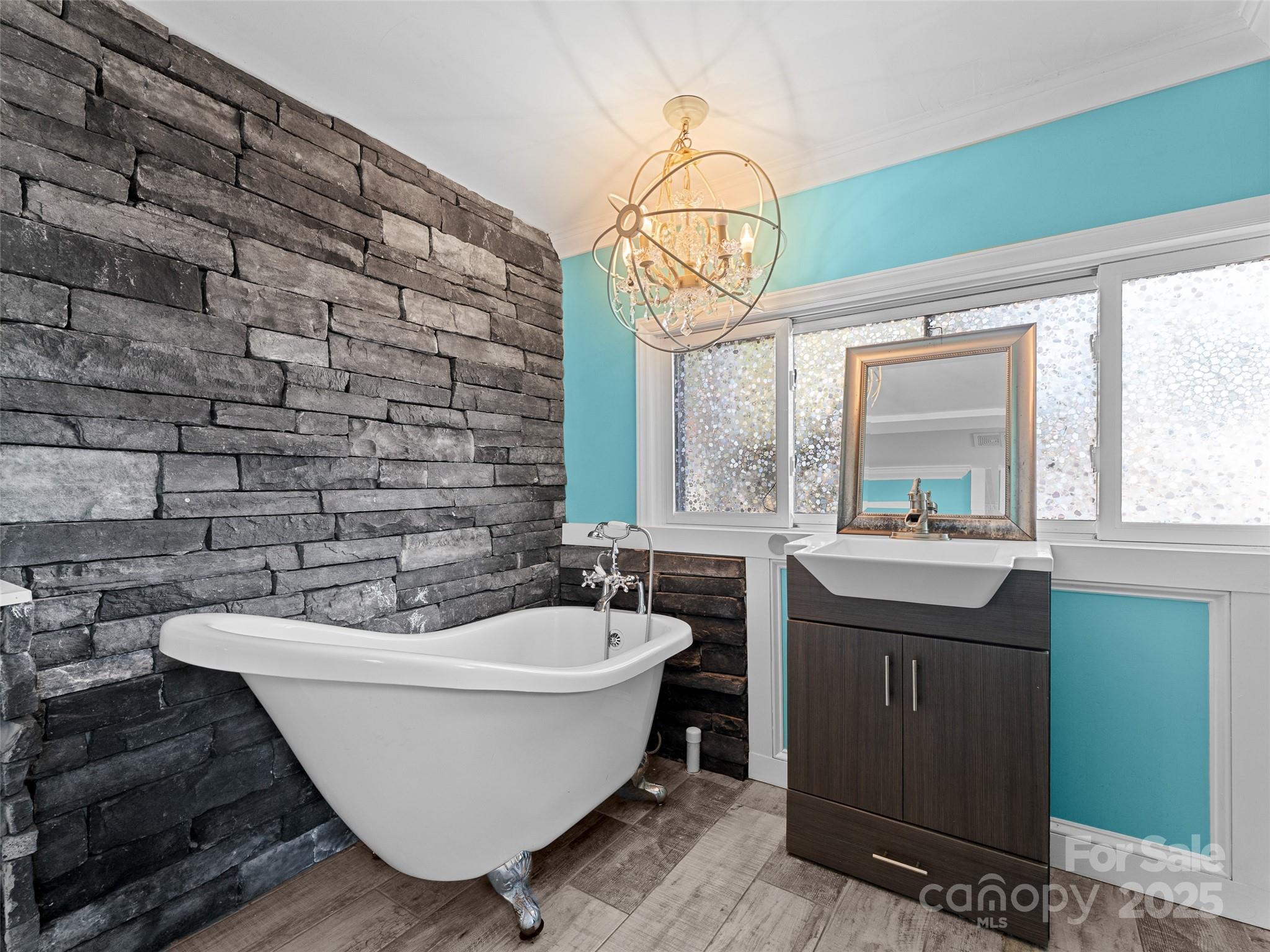1148 North Ridge Road Hendersonville, NC 28792 - Photo 39 of 42 a bathroom with a bathtub and sink