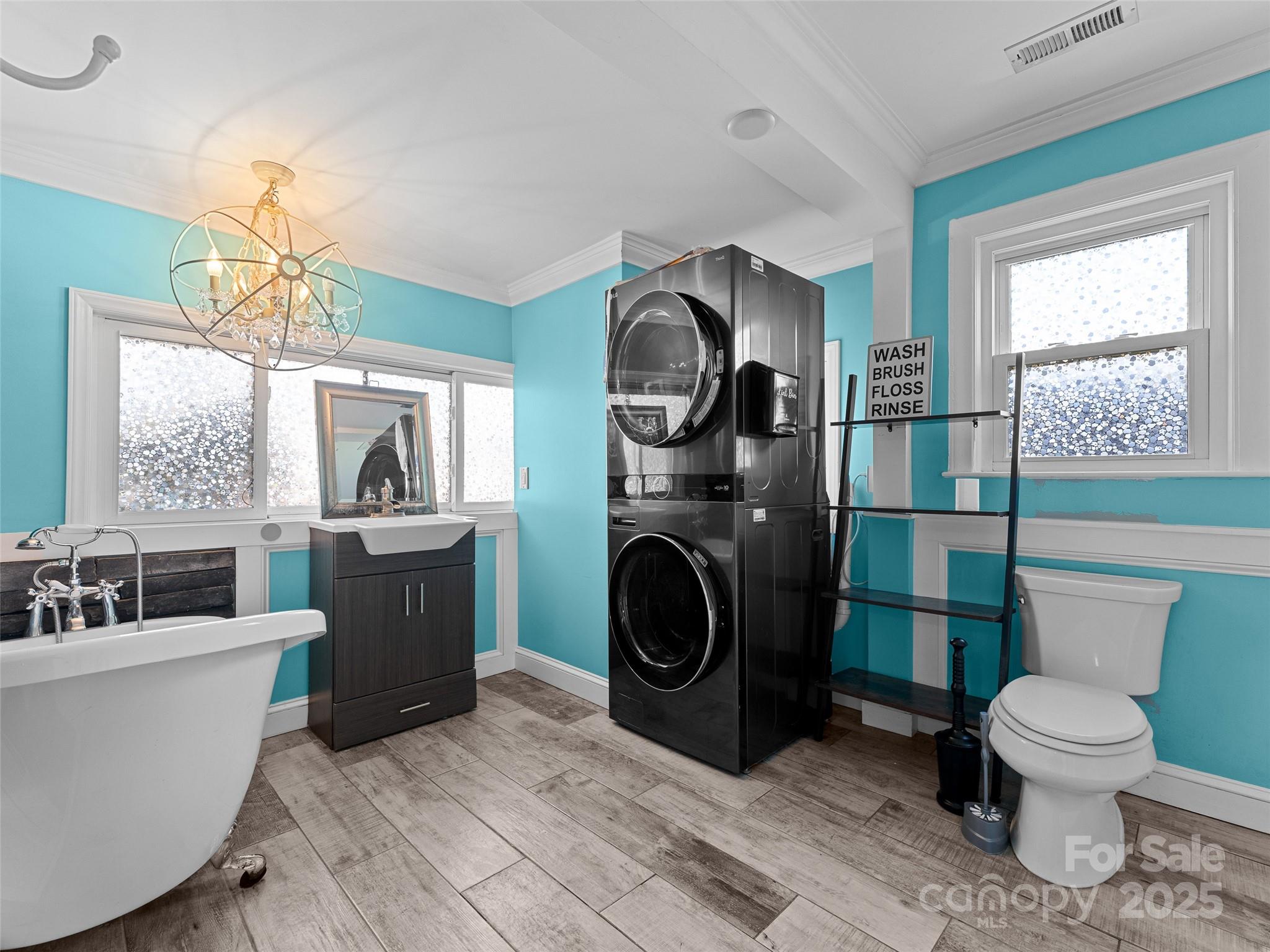1148 North Ridge Road Hendersonville, NC 28792 - Photo 41 of 42 a bathroom with a toilet sink and mirror