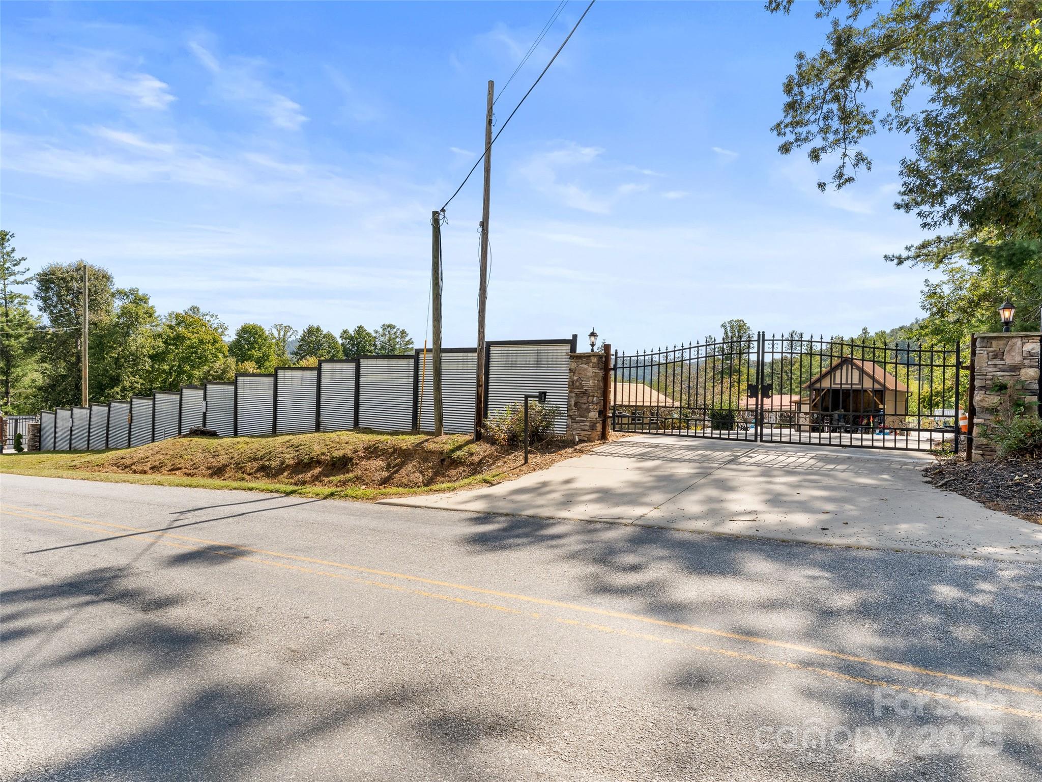 1148 North Ridge Road Hendersonville, NC 28792 - Photo 5 of 42 a view of a terrace with a bench