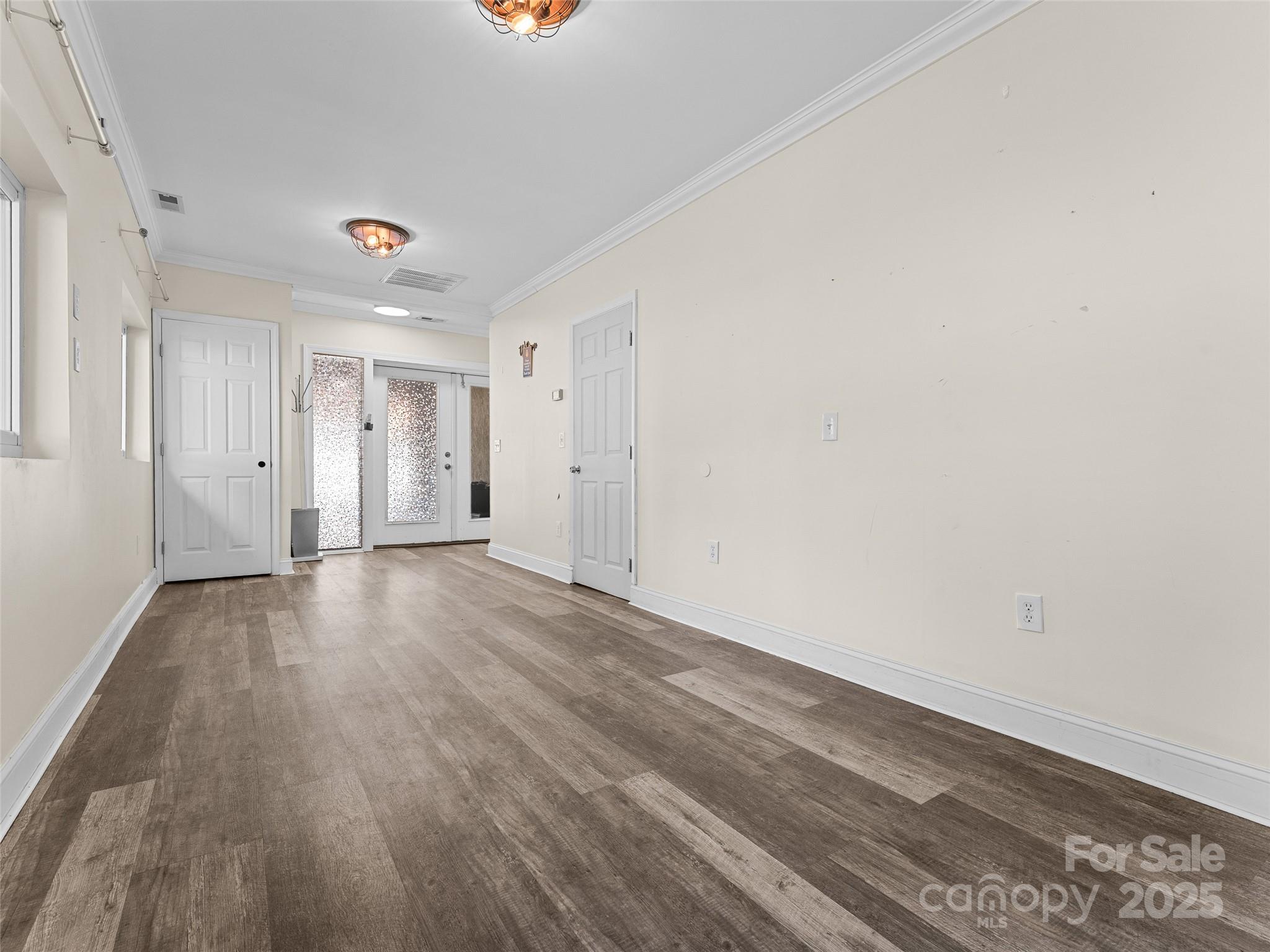 1148 North Ridge Road Hendersonville, NC 28792 - Photo 10 of 42 a view of an empty room with wooden floor