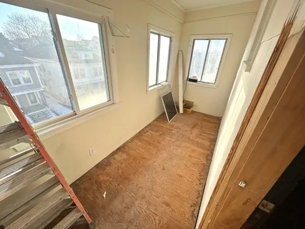 a view of a hallway with washer and dryer