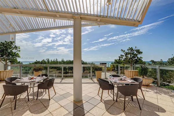 a view of a tables and chairs in patio
