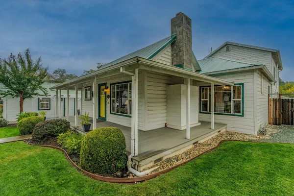 a front view of a house with a yard