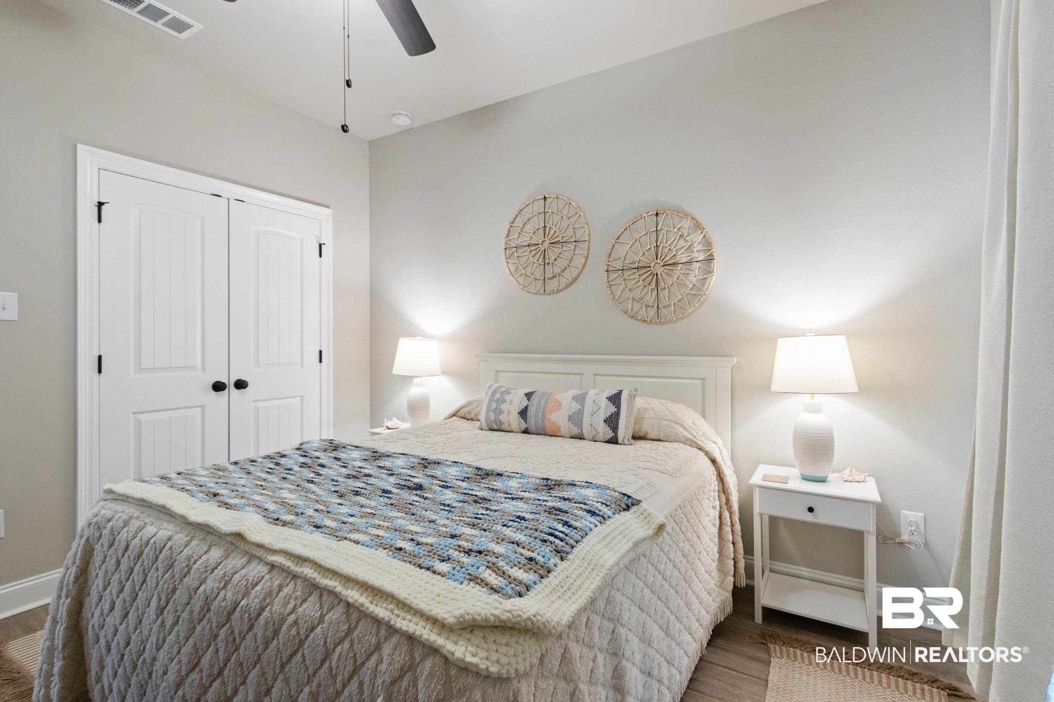 22244 Hibiscus Circle Foley, AL 36535 - Photo 44 of 51 Bedroom with wood-finish flooring, light-toned walls, and a ceiling fan