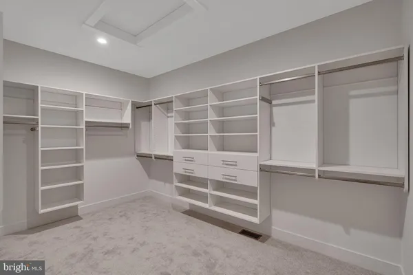 a view of an empty walk in closet