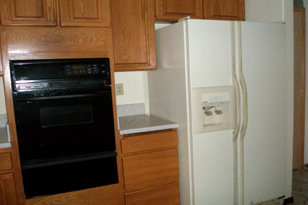 1291 Puuopae Road Kapaa, HI 96746 - Photo 14 of 25 a kitchen with a refrigerator and a stove