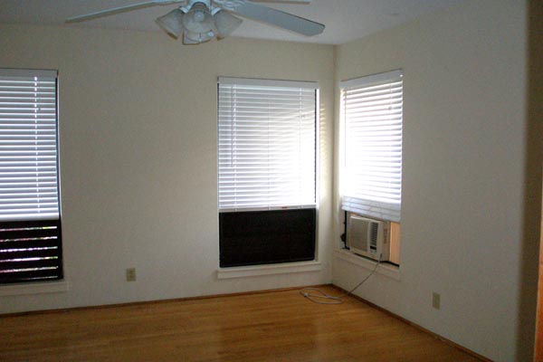 1291 Puuopae Road Kapaa, HI 96746 - Photo 21 of 25 a view of an empty room with a window and fireplace