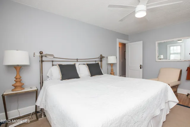 a bedroom with a bed and a table in it