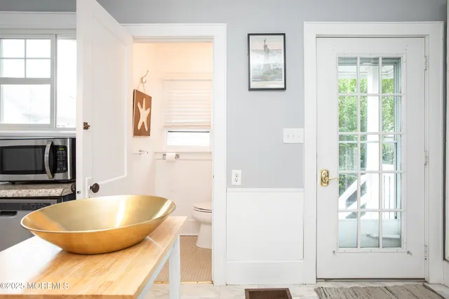 a bathroom with a tub and a sink