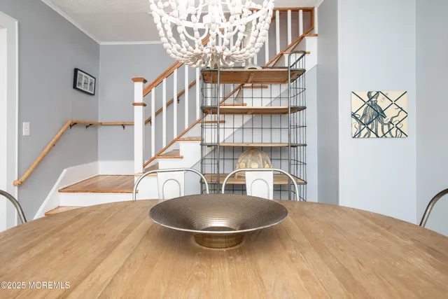 a living room with fireplace furniture and a wooden floor