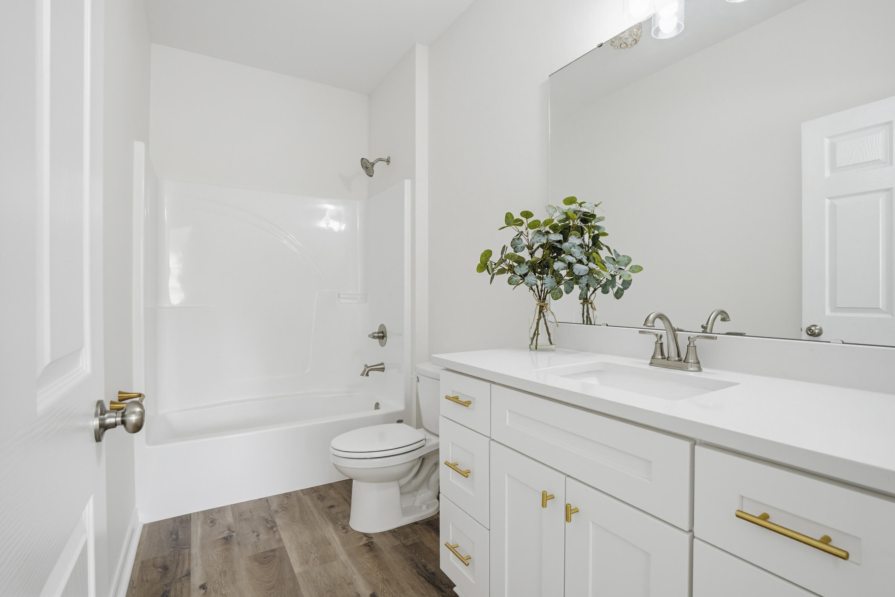 3810 Golden Acres Circle Crestview, FL 32539 - Photo 6 of 9 a bathroom with a sink a toilet and shower