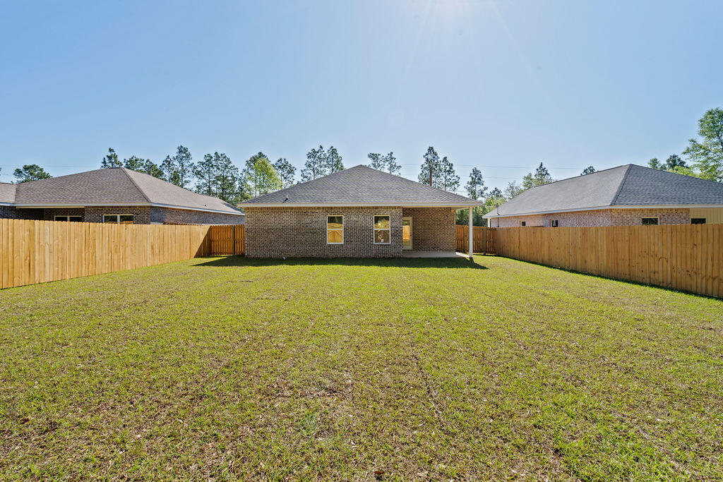 3810 Golden Acres Circle Crestview, FL 32539 - Photo 9 of 9 a front view of a house with a yard