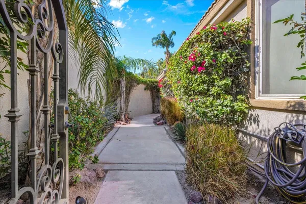 a view of an empty room with a fireplace and a large window