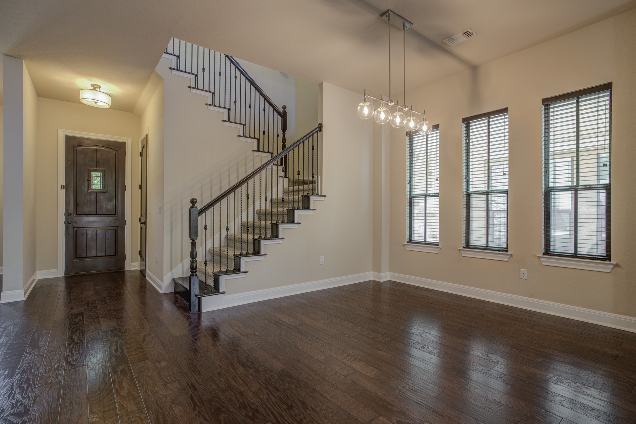 4524 Berkman Drive Austin, TX 78723 - Photo 14 of 38 Spacious entry hall featuring dark wood-finish flooring extending into the main living area