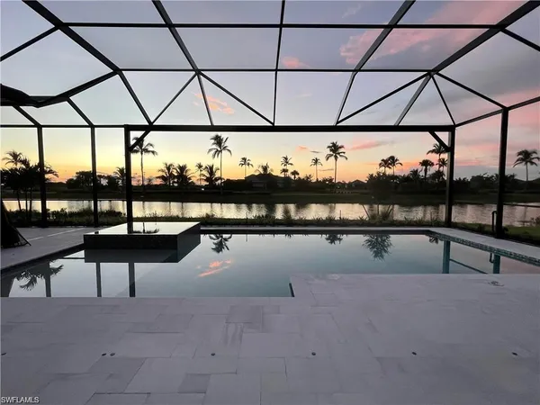 a view of swimming pool with seating space