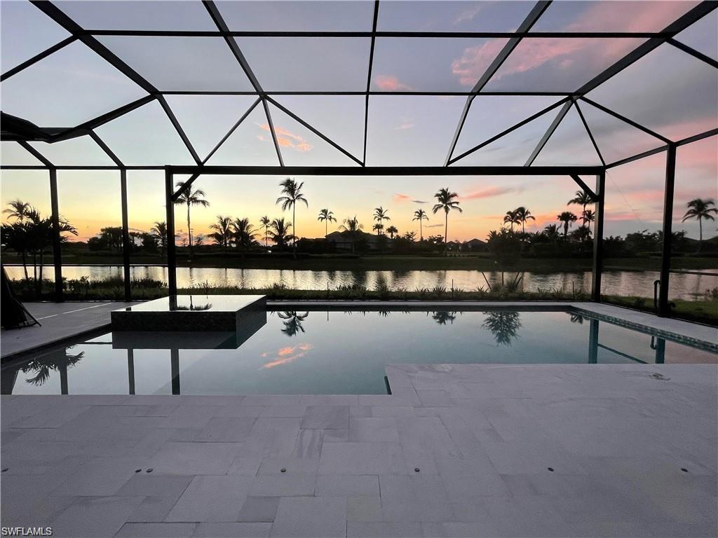 15587 Montello Lane Naples, FL 34114 - Photo 11 of 17 a view of swimming pool with seating space