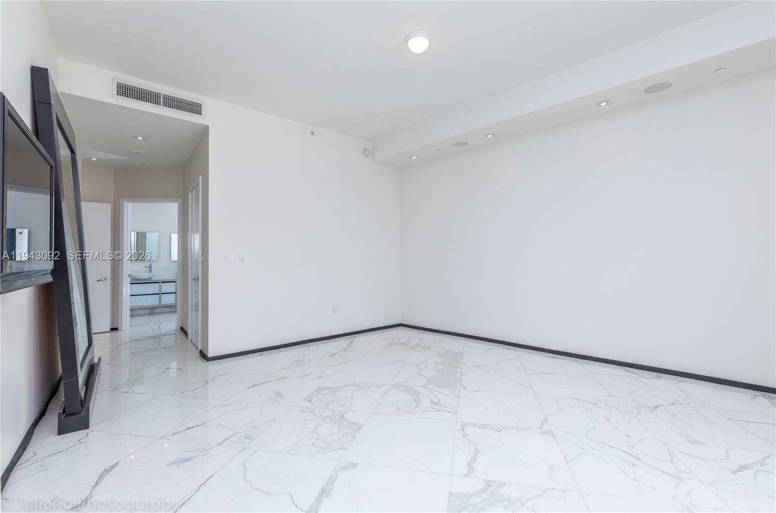 901 Brickell Key Boulevard, Unit 3407 Miami, FL 33131 - Photo 12 of 44 a view of a room with a hallway