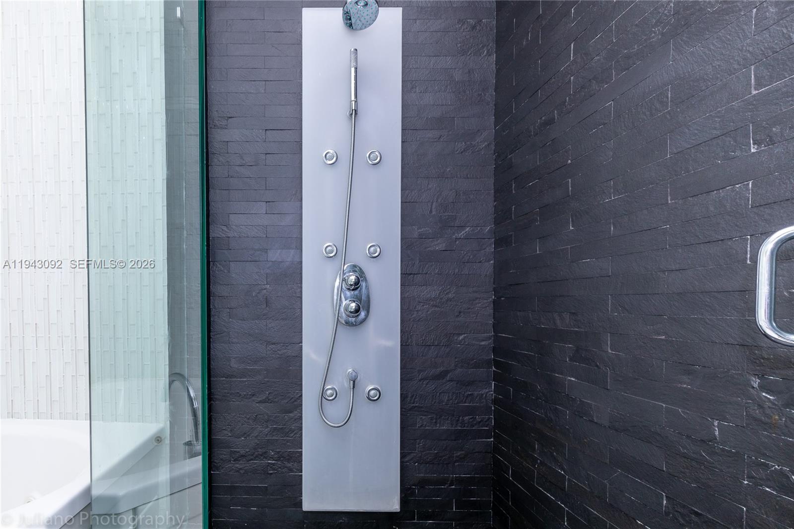 901 Brickell Key Boulevard, Unit 3407 Miami, FL 33131 - Photo 15 of 44 a bathroom with a shower