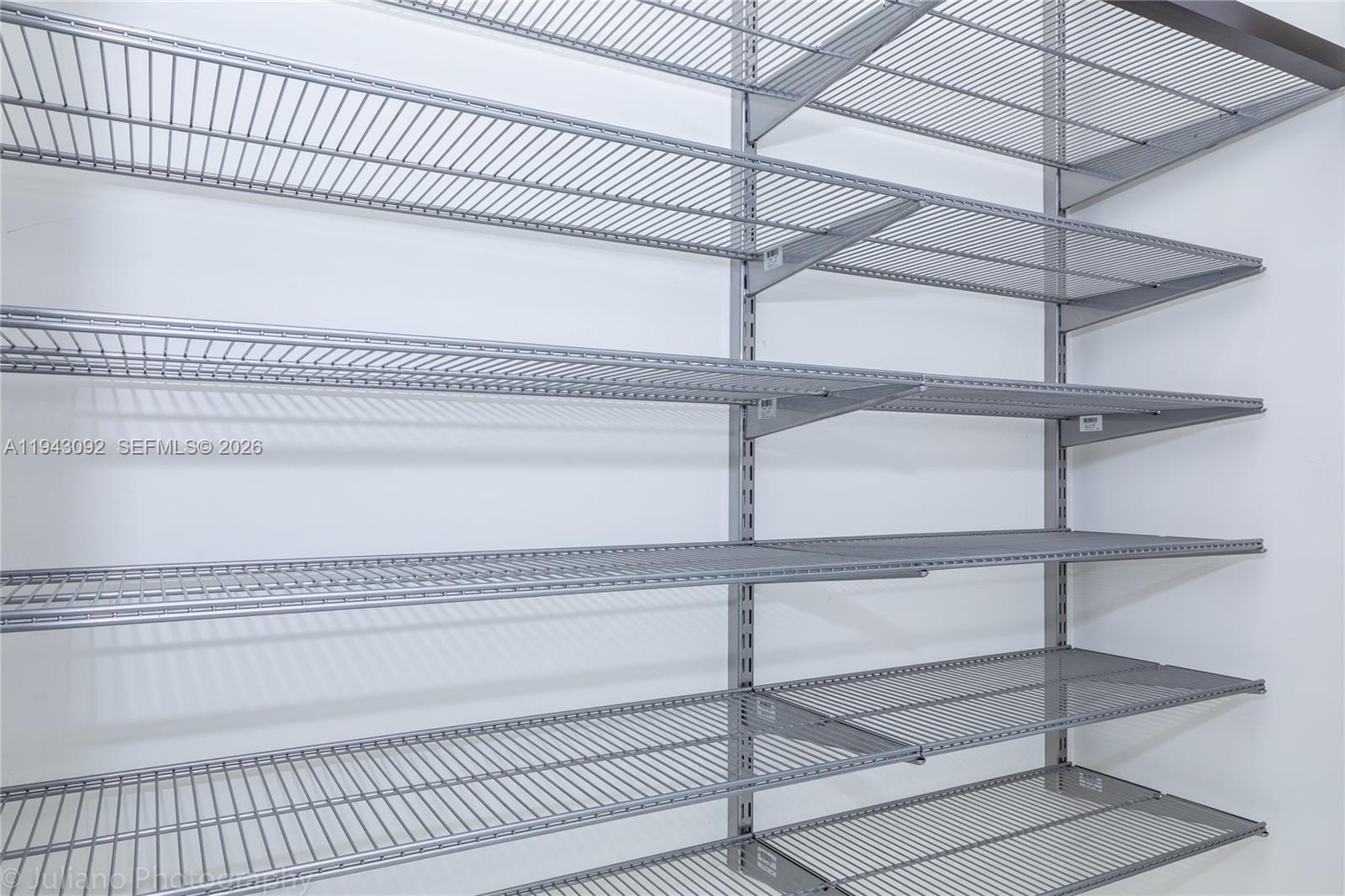 901 Brickell Key Boulevard, Unit 3407 Miami, FL 33131 - Photo 21 of 44 a view of a room with rack on the wall