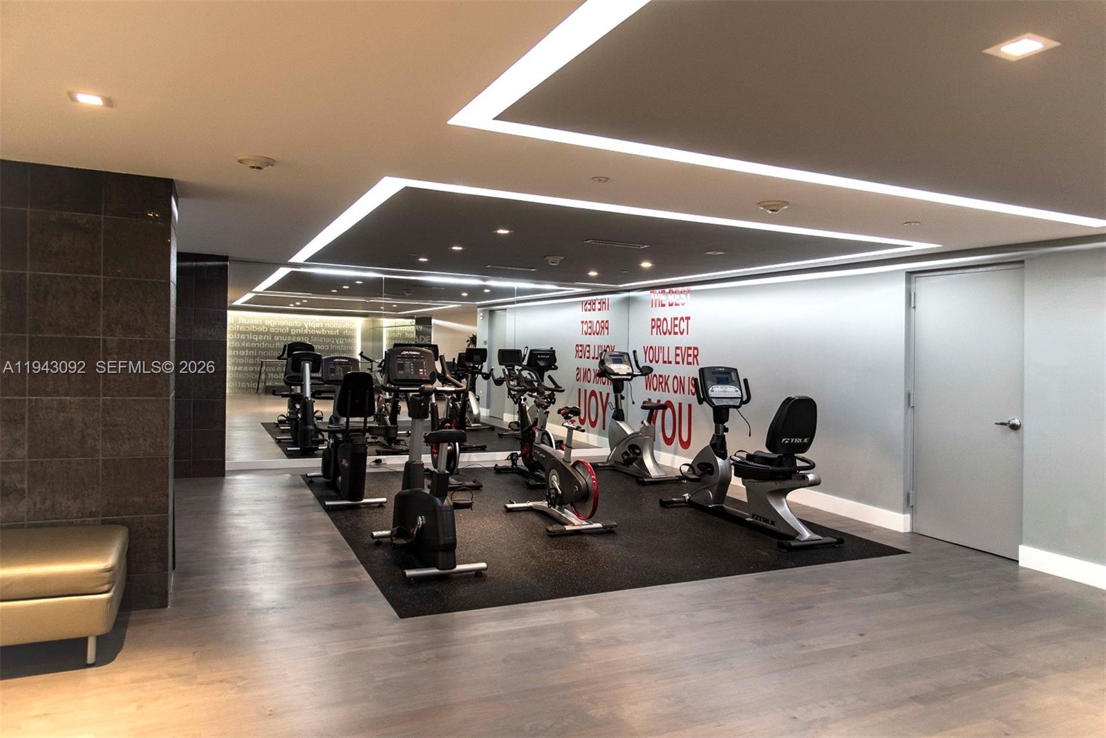 901 Brickell Key Boulevard, Unit 3407 Miami, FL 33131 - Photo 32 of 44 a view of a room with gym equipment