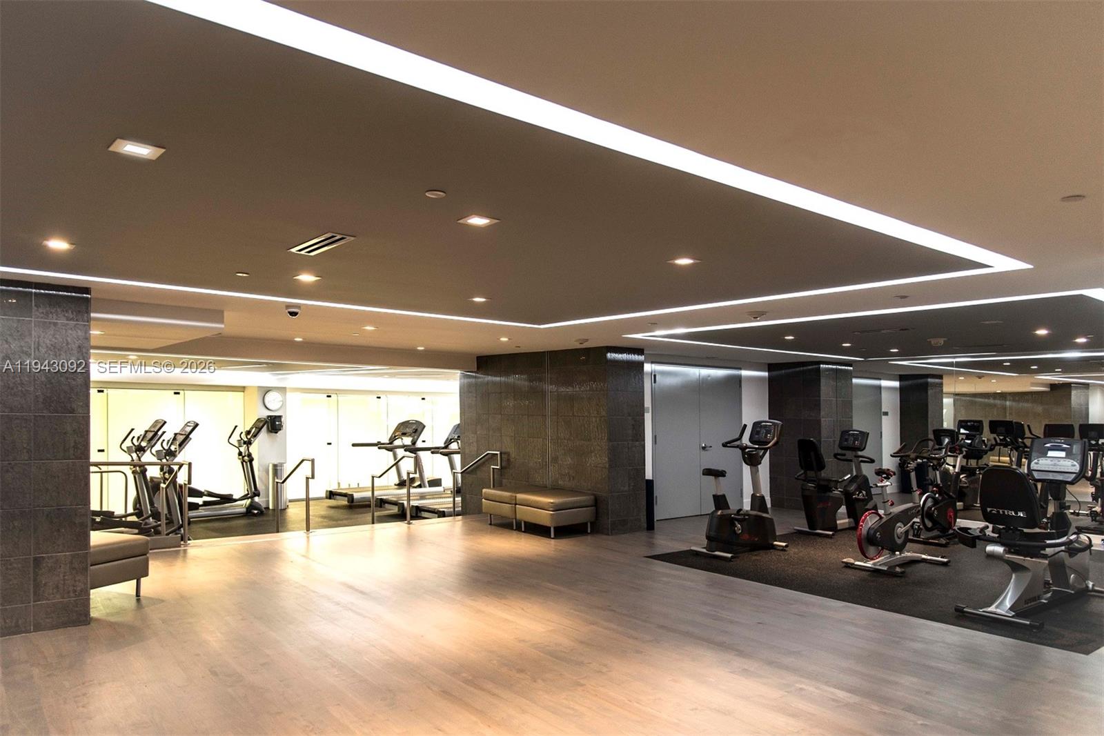 901 Brickell Key Boulevard, Unit 3407 Miami, FL 33131 - Photo 33 of 44 a view of a room with gym equipment