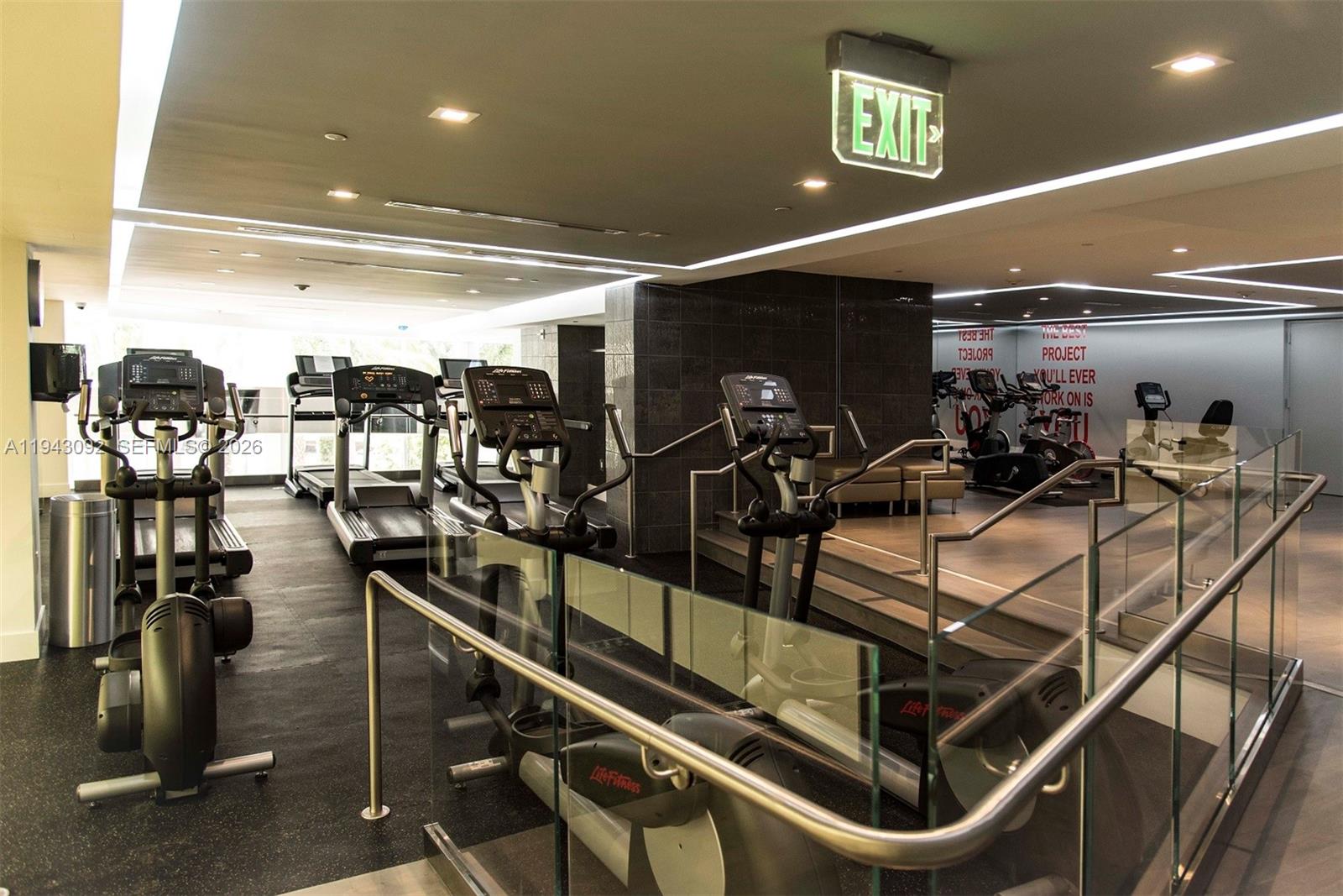 901 Brickell Key Boulevard, Unit 3407 Miami, FL 33131 - Photo 34 of 44 a room with gym equipment