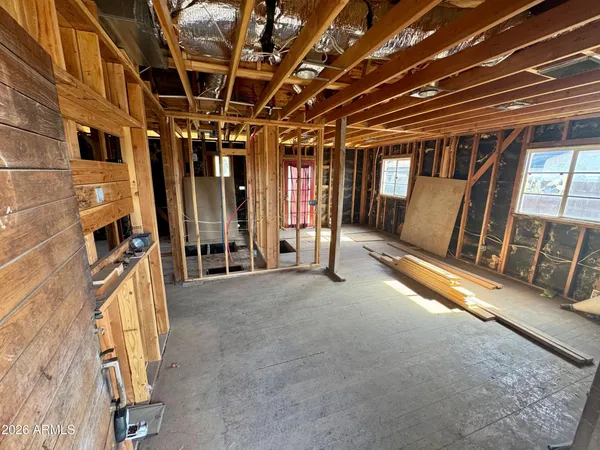 a view of an empty room with wooden walls
