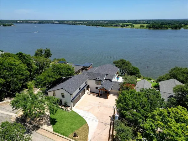 an aerial view of a house with lake view