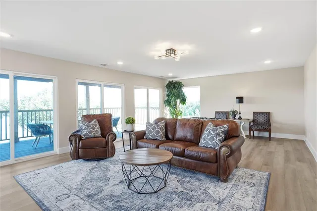 a bathroom with a double vanity sink toilet mirror and shower