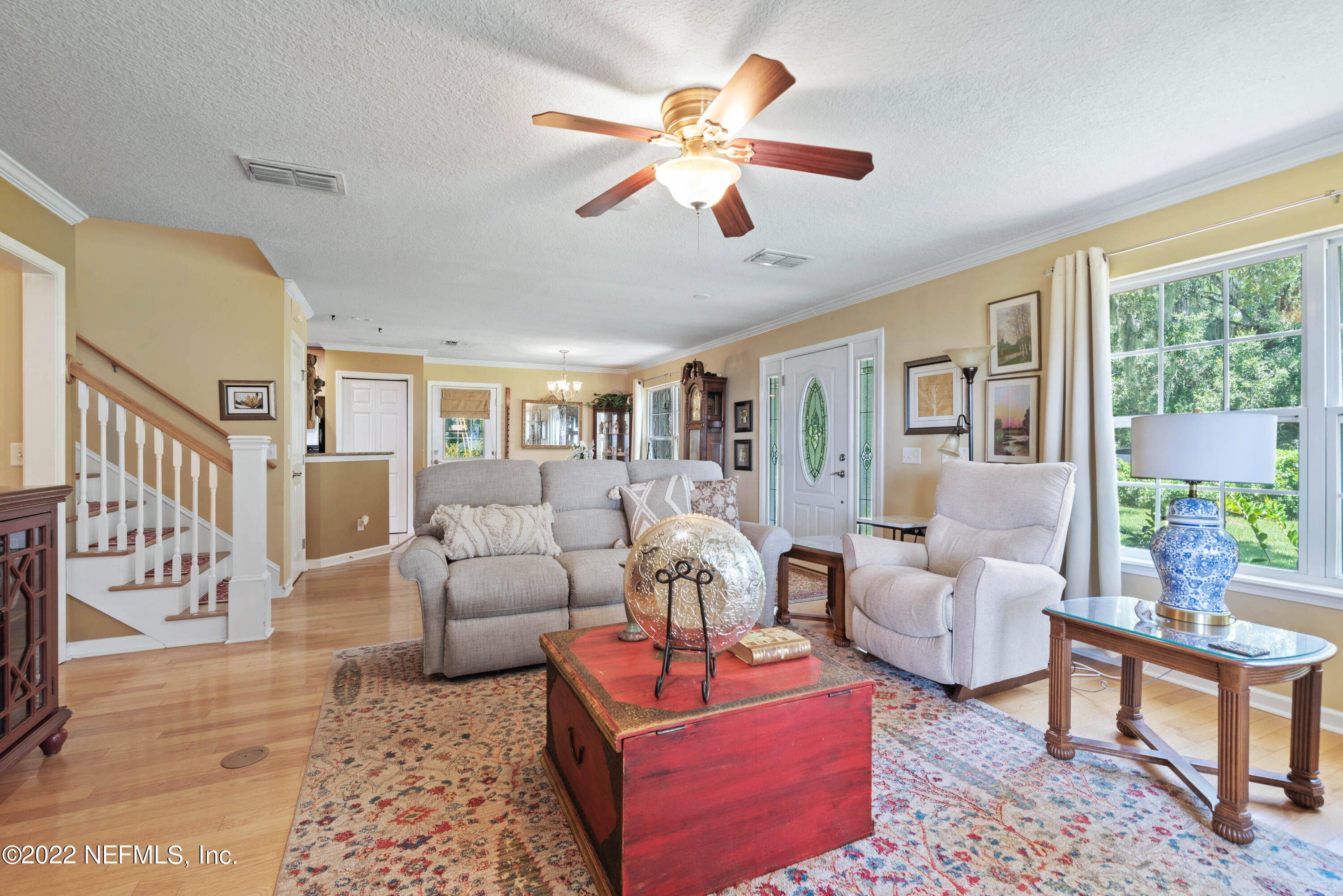5345 Pine Avenue Fleming Island, FL 32003 - Photo 13 of 39 a living room with furniture and a large window