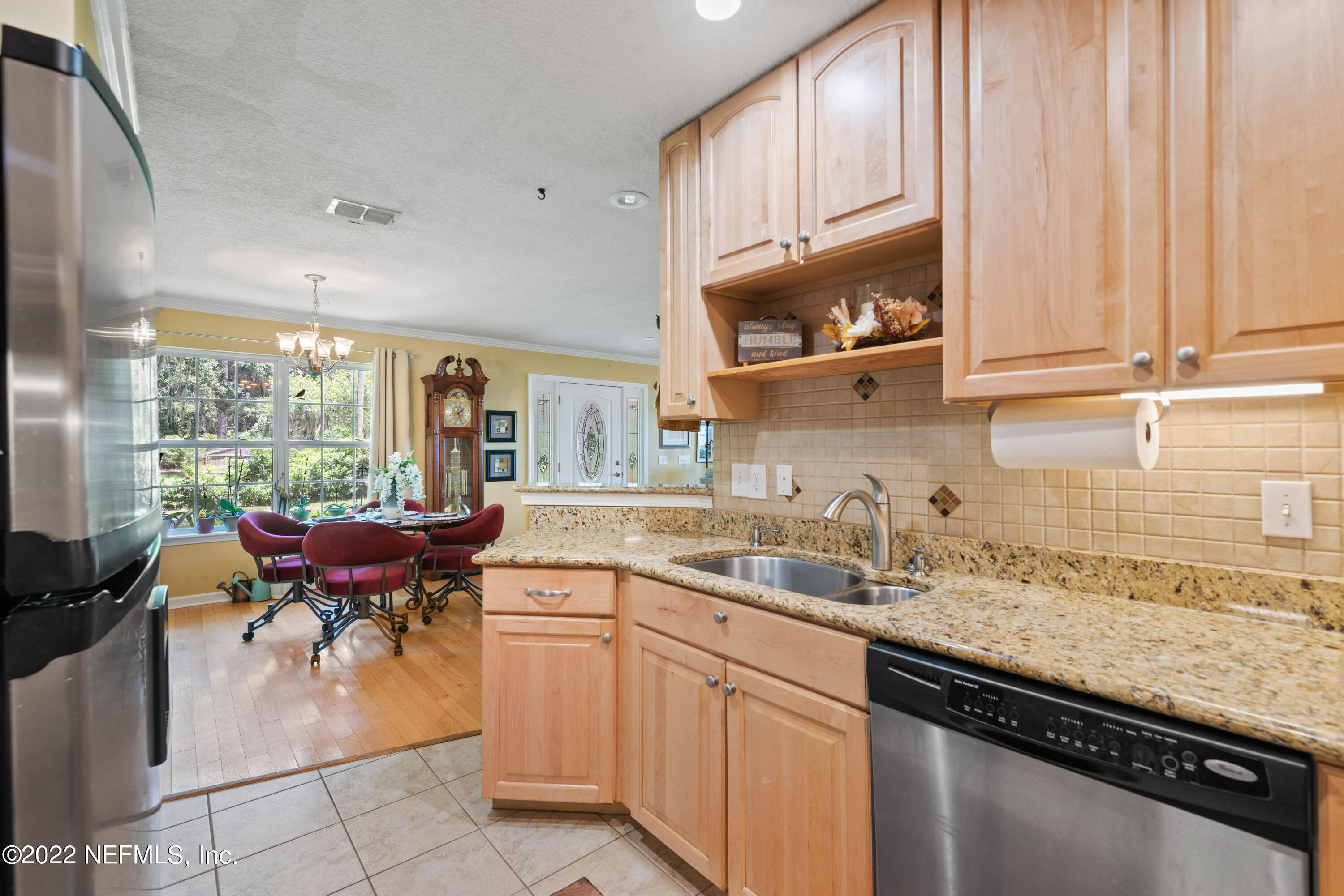5345 Pine Avenue Fleming Island, FL 32003 - Photo 14 of 39 a kitchen with a sink and cabinets