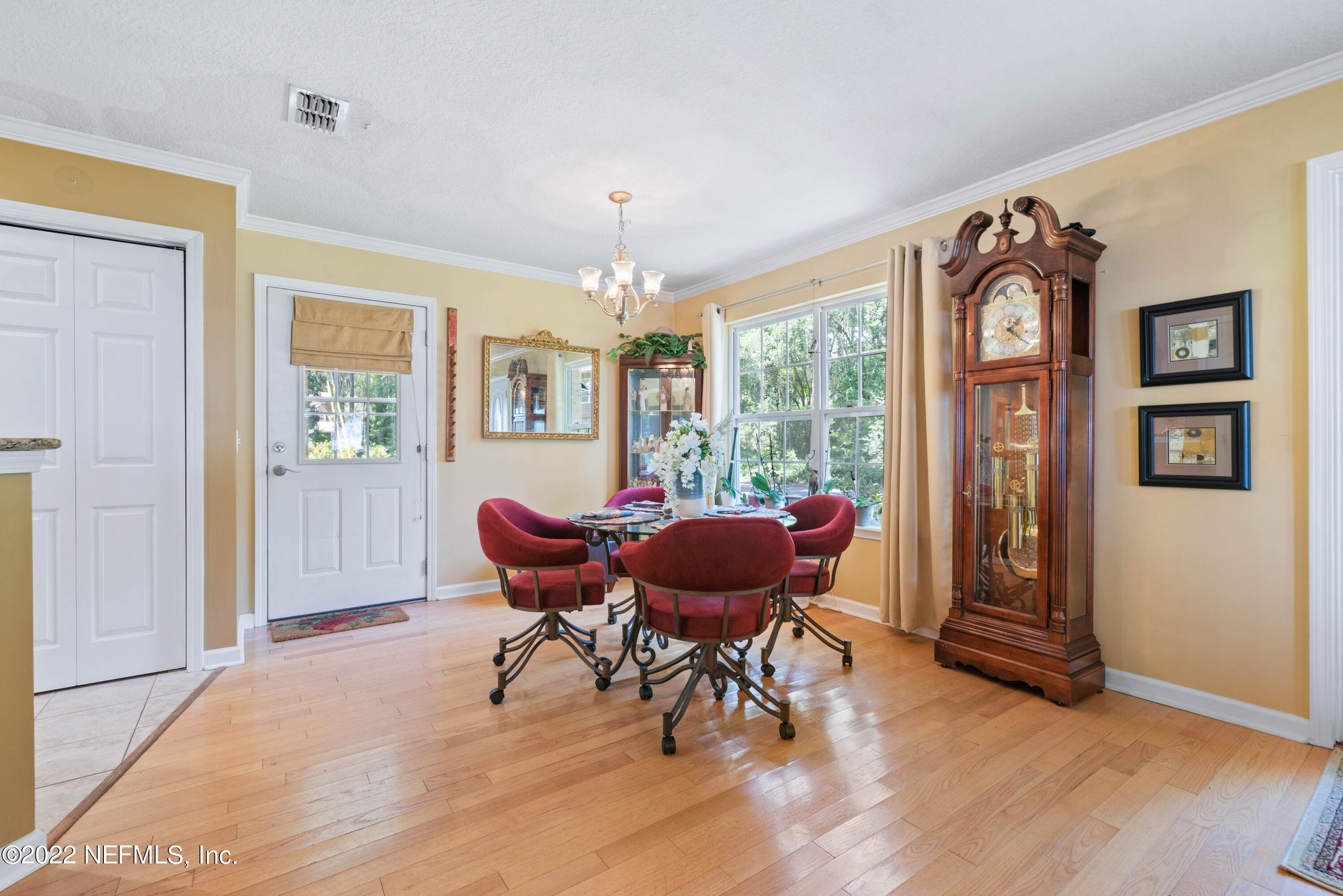 5345 Pine Avenue Fleming Island, FL 32003 - Photo 15 of 39 a view of a dining room with furniture window and wooden floor