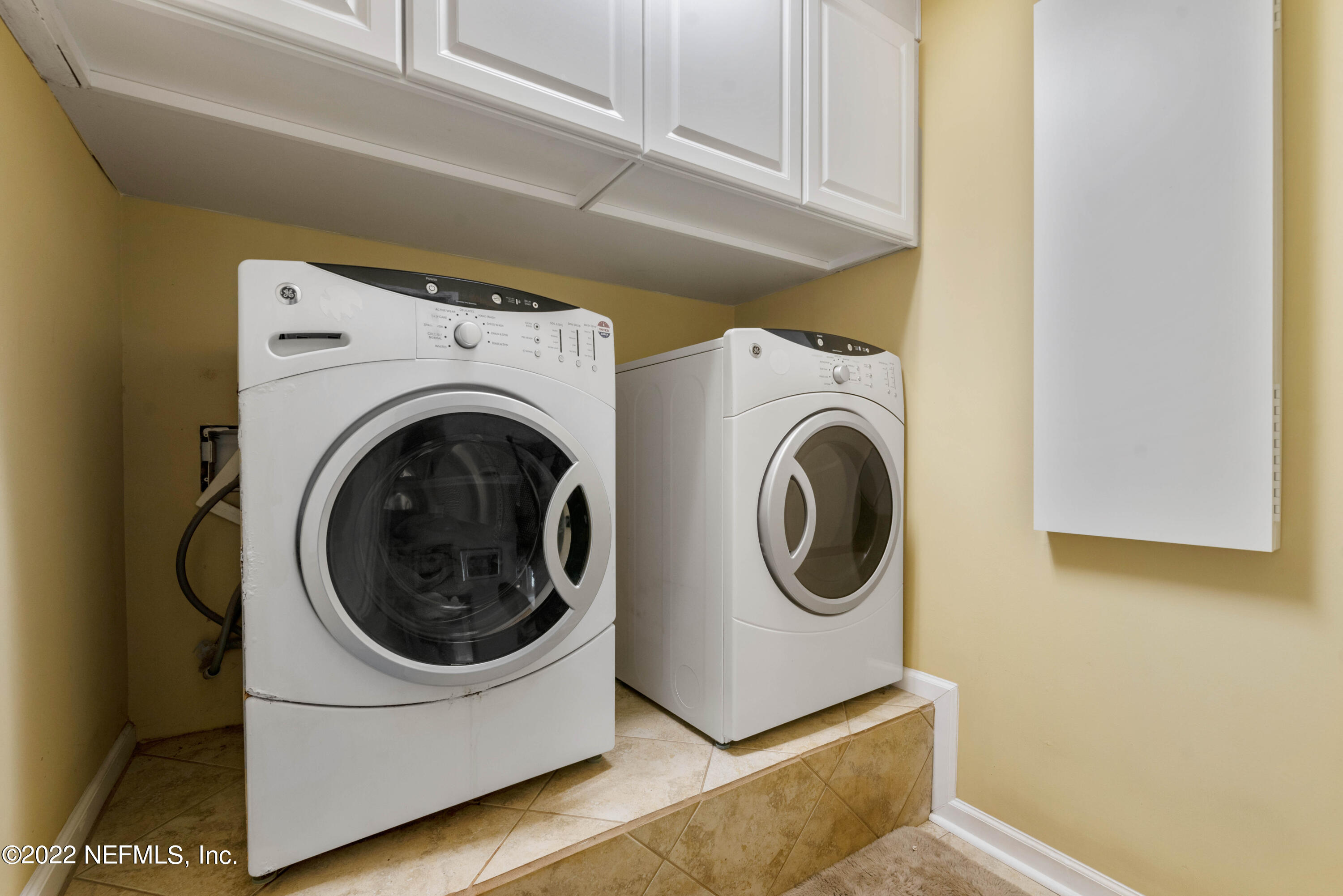 5345 Pine Avenue Fleming Island, FL 32003 - Photo 18 of 39 a utility room with dryer and washer