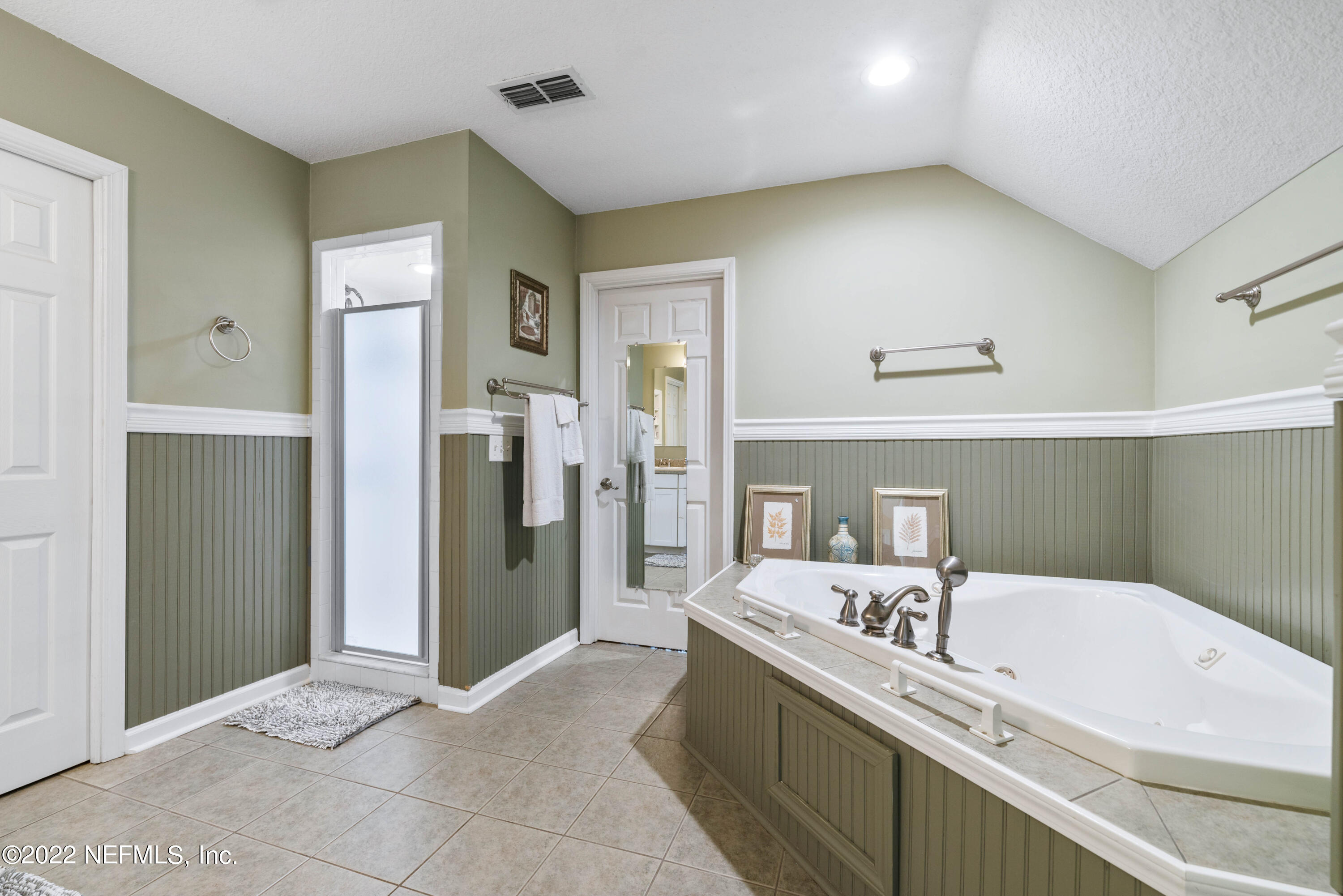 5345 Pine Avenue Fleming Island, FL 32003 - Photo 27 of 39 a bathroom with a bathtub and a sink