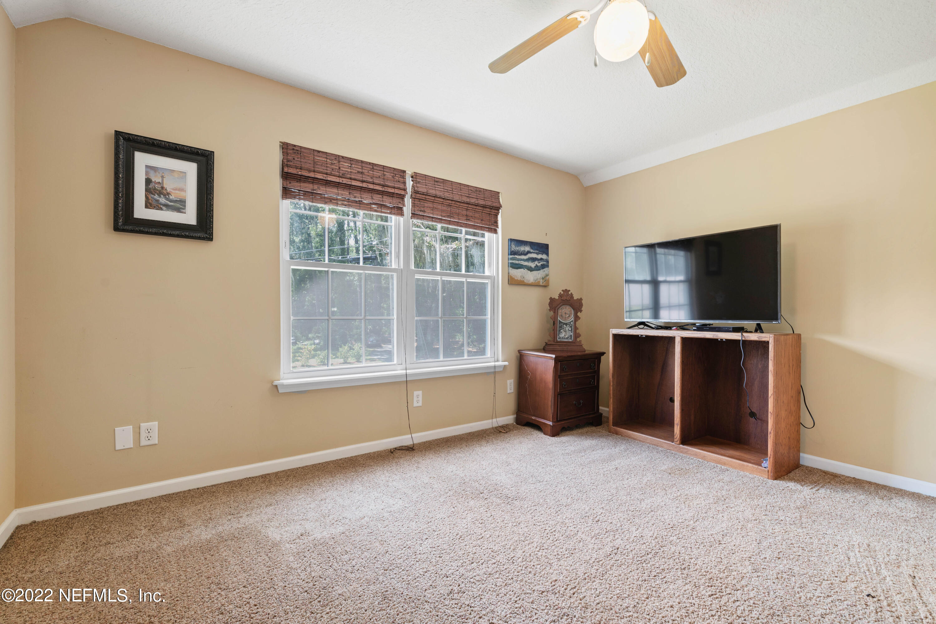 5345 Pine Avenue Fleming Island, FL 32003 - Photo 28 of 39 a view of room with window and a flat screen tv