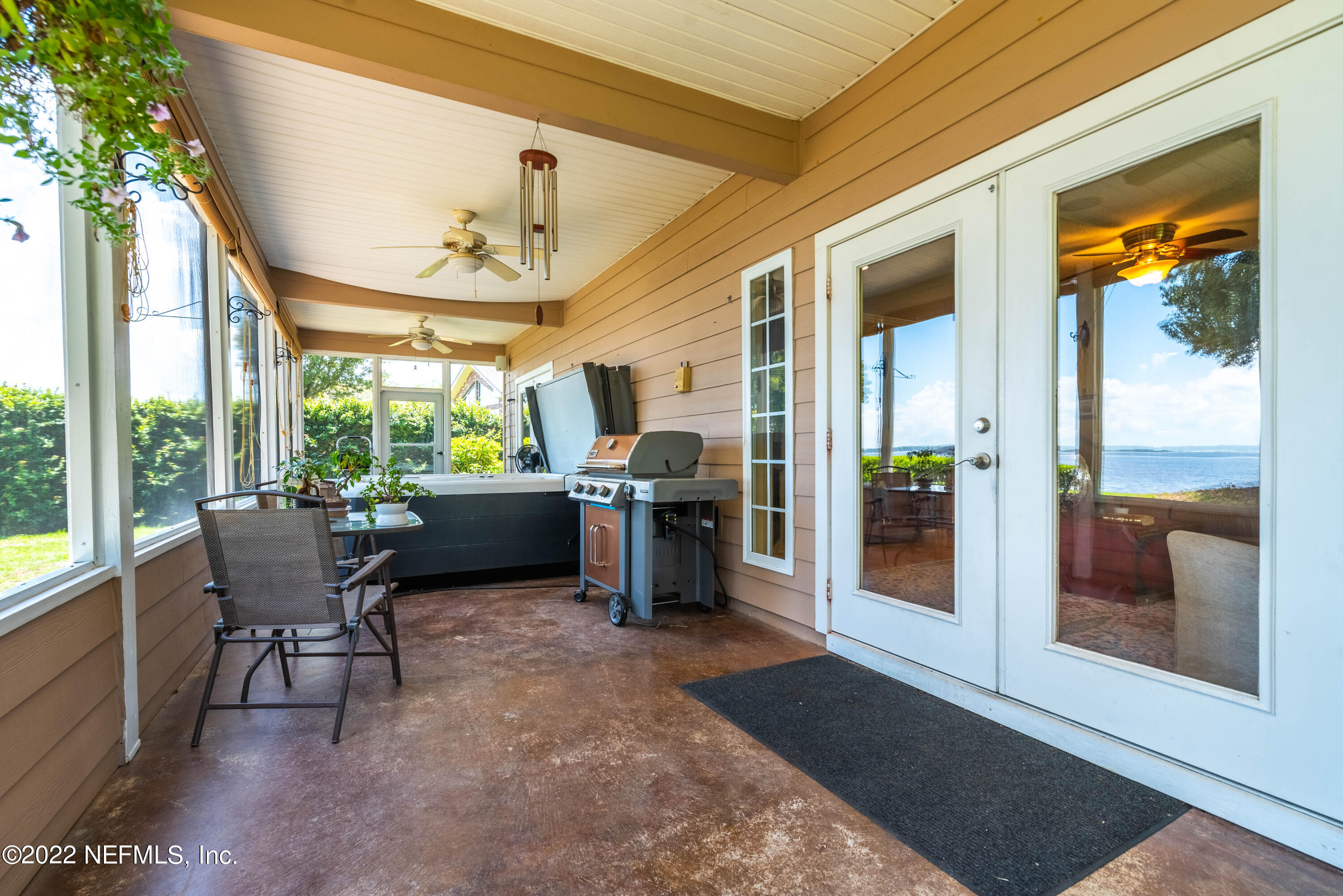 5345 Pine Avenue Fleming Island, FL 32003 - Photo 29 of 39 a view of a patio with a tv table and chairs